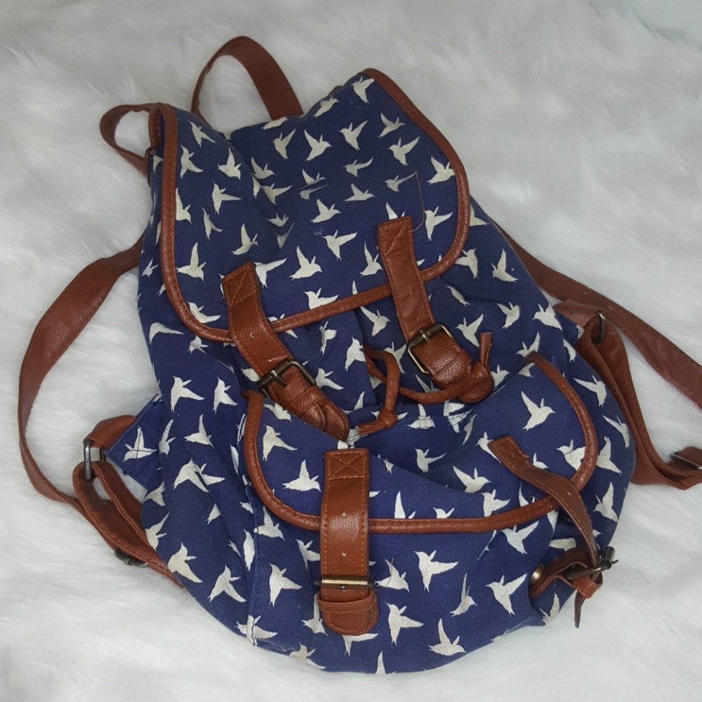 Blue and brown leather backpack